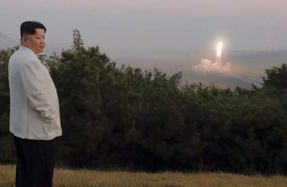 In a photo provided by the North Korean government, Kim Jong Un inspects a missile test at an undisclosed location. Photograph: AP