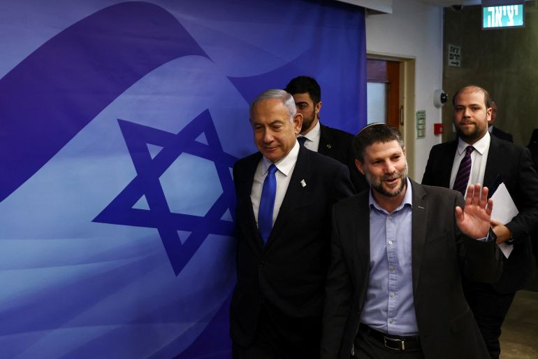 Israeli Prime Minister Benjamin Netanyahu and Finance Minister Bezalel Smotrich arrive to attend a cabinet meeting at the Prime Minister's office in Jerusalem